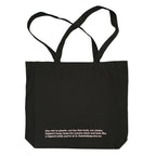 Black tote bag with soft pink text on a white background