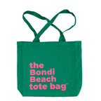 Green tote bag with pink text 'the Bondi Beach tote bag' on a white background