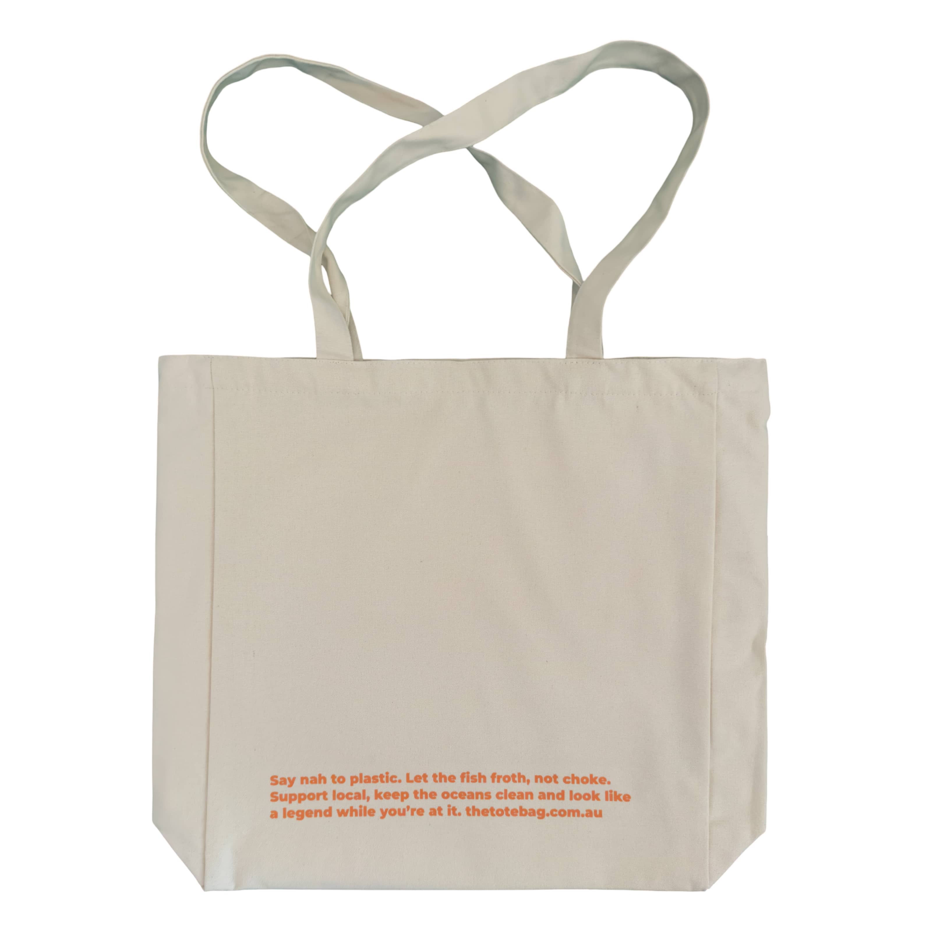 Beige tote bag with orange text on a white background