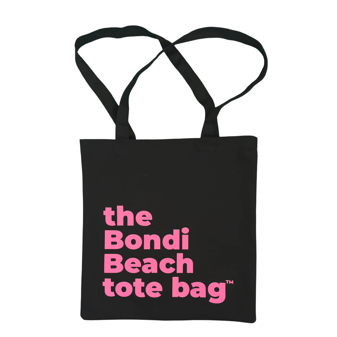 The Bondi Beach tote bag Little Bondi in black with fluro pink print flatlay closed showing slim canvas