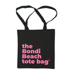 Black tote bag with pink text 'the Bondi Beach tote bag' on a white background