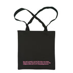 Black tote bag with pink text on a white background