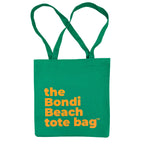 Green tote bag with 'the Bondi Beach tote bag' text in peach orange 