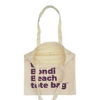 Beige tote bag with 'Bondi Beach tote bag' text on a white background