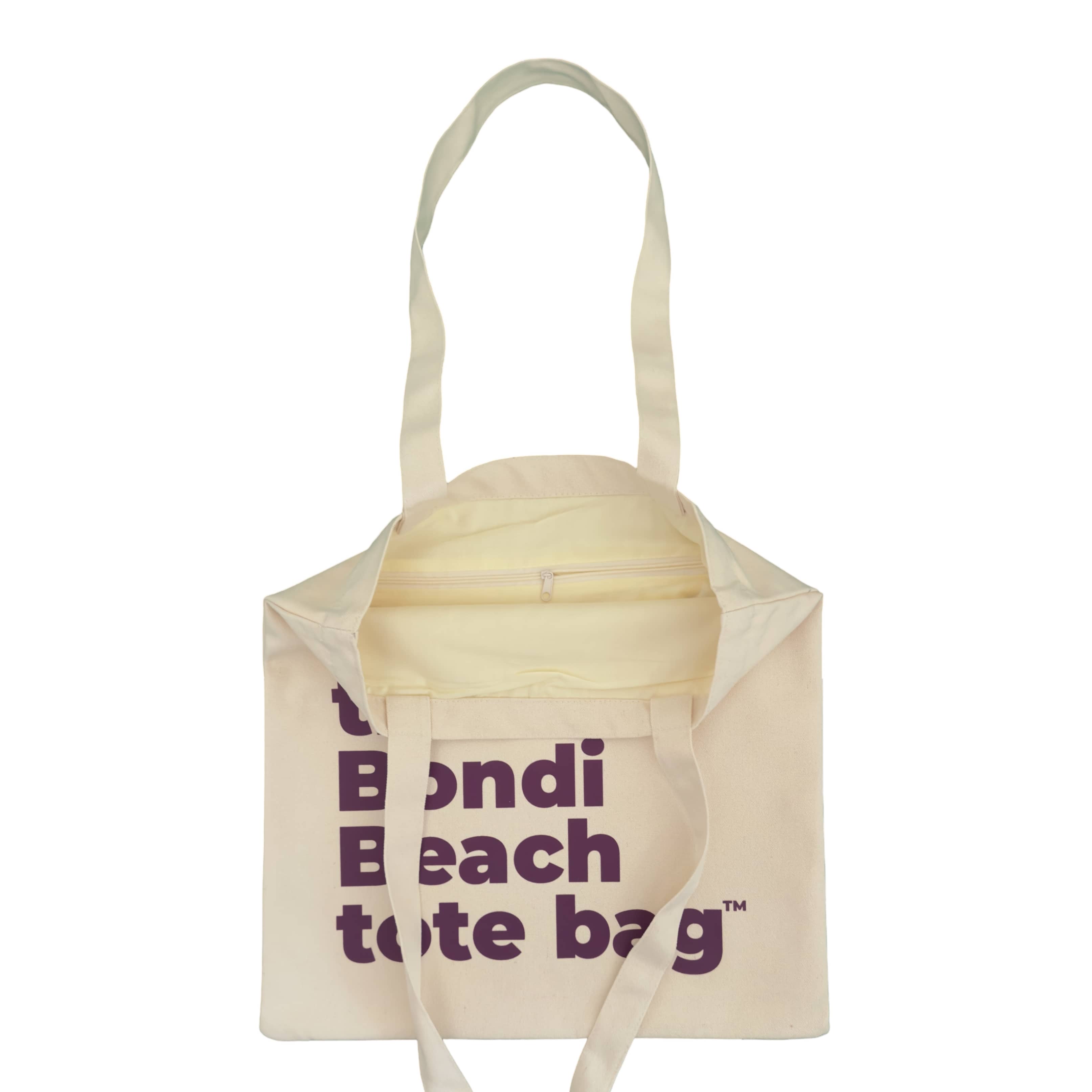 Beige tote bag with 'Bondi Beach tote bag' text on a white background