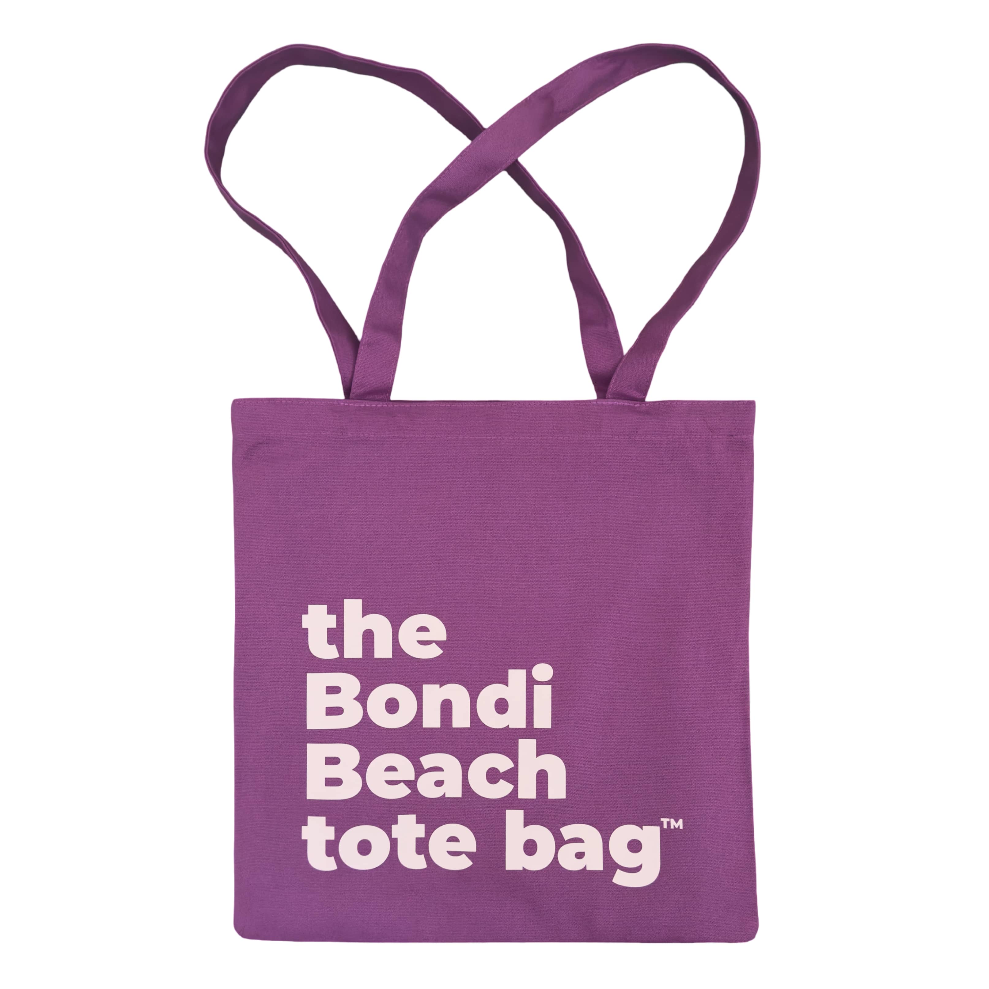 Purple tote bag with 'the Bondi Beach tote bag' text in soft pink