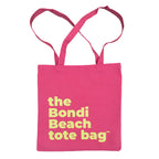 Pink tote bag with 'the Bondi Beach tote bag' text in fluro green