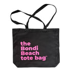 The Bondi Beach tote bag Big Bondi in black with pink print flatlay closed showing durable structured canvas