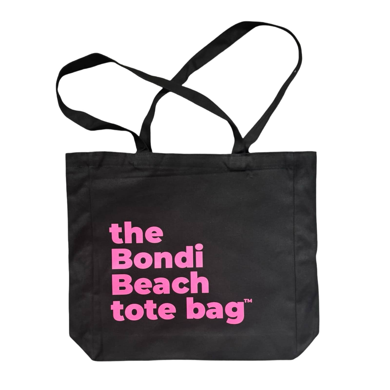 The Bondi Beach tote bag Big Bondi in black with pink print flatlay closed showing durable structured canvas