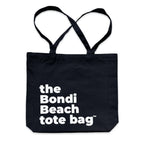 The Bondi Beach tote bag Big Bondi in black with white print flatlay closed showing durable structured canvas