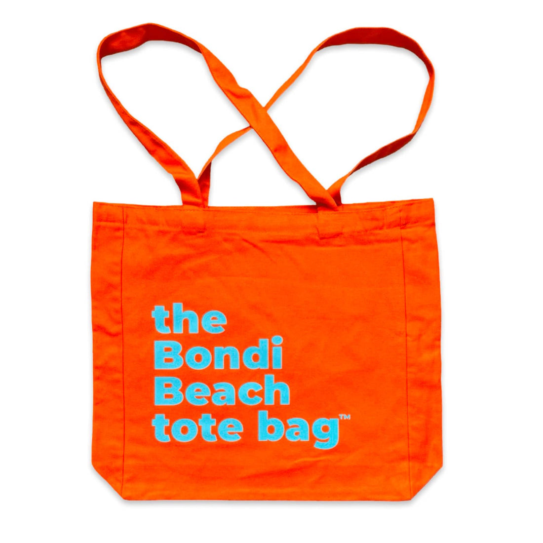 The Bondi Beach tote bag Big Bondi in orange with blue print flatlay closed showing structured canvas