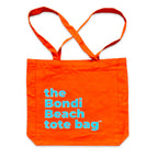 The Bondi Beach tote bag Big Bondi in orange with blue print flatlay closed showing structured canvas