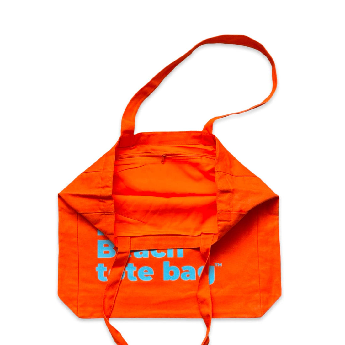 The Bondi Beach tote bag Big Bondi in orange with blue print open showing zip pocket and lining
