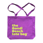 The Bondi Beach tote bag Big Bondi in purple with green print flatlay closed showing structured canvas