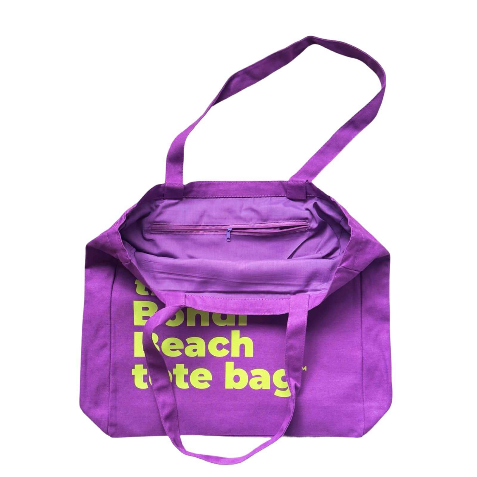 The Bondi Beach tote bag Big Bondi in purple with orange print open showing zip pocket and lining