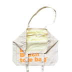 The Bondi Beach tote bag Big Bondi in off white with peach orange print open showing zip pocket and lining