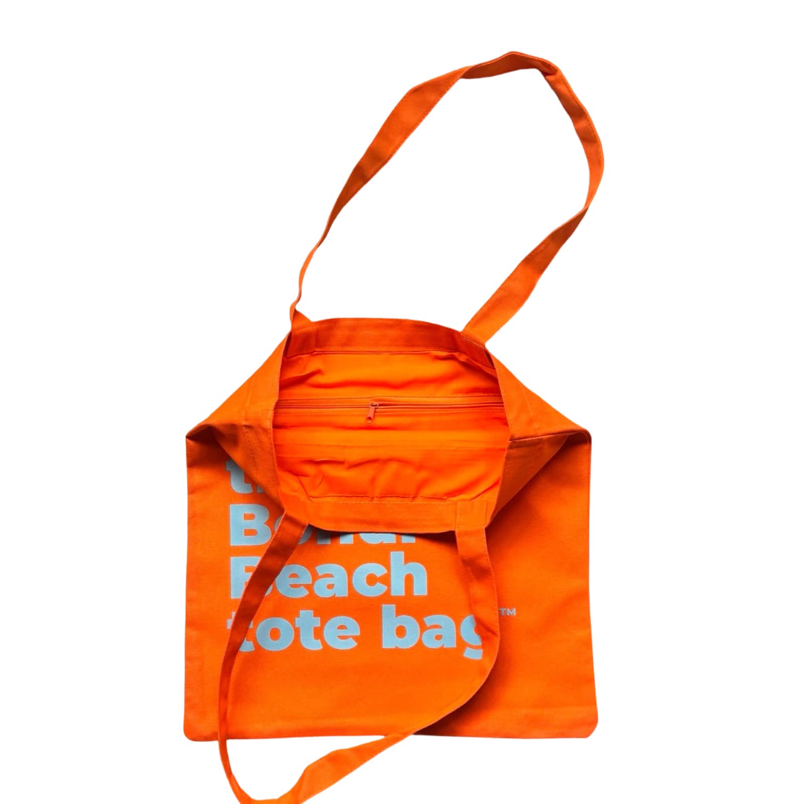 The Bondi Beach tote bag Little Bondi in orange with blue print open showing zip pocket and lining
