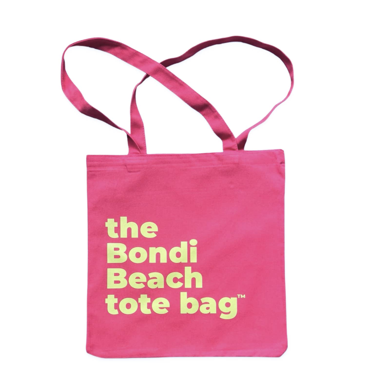 The Bondi Beach tote bag Little Bondi in pink with green print flatlay closed showing slim durable canvas