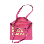The Bondi Beach tote bag Little Bondi in pink with green print open showing zip pocket and lining