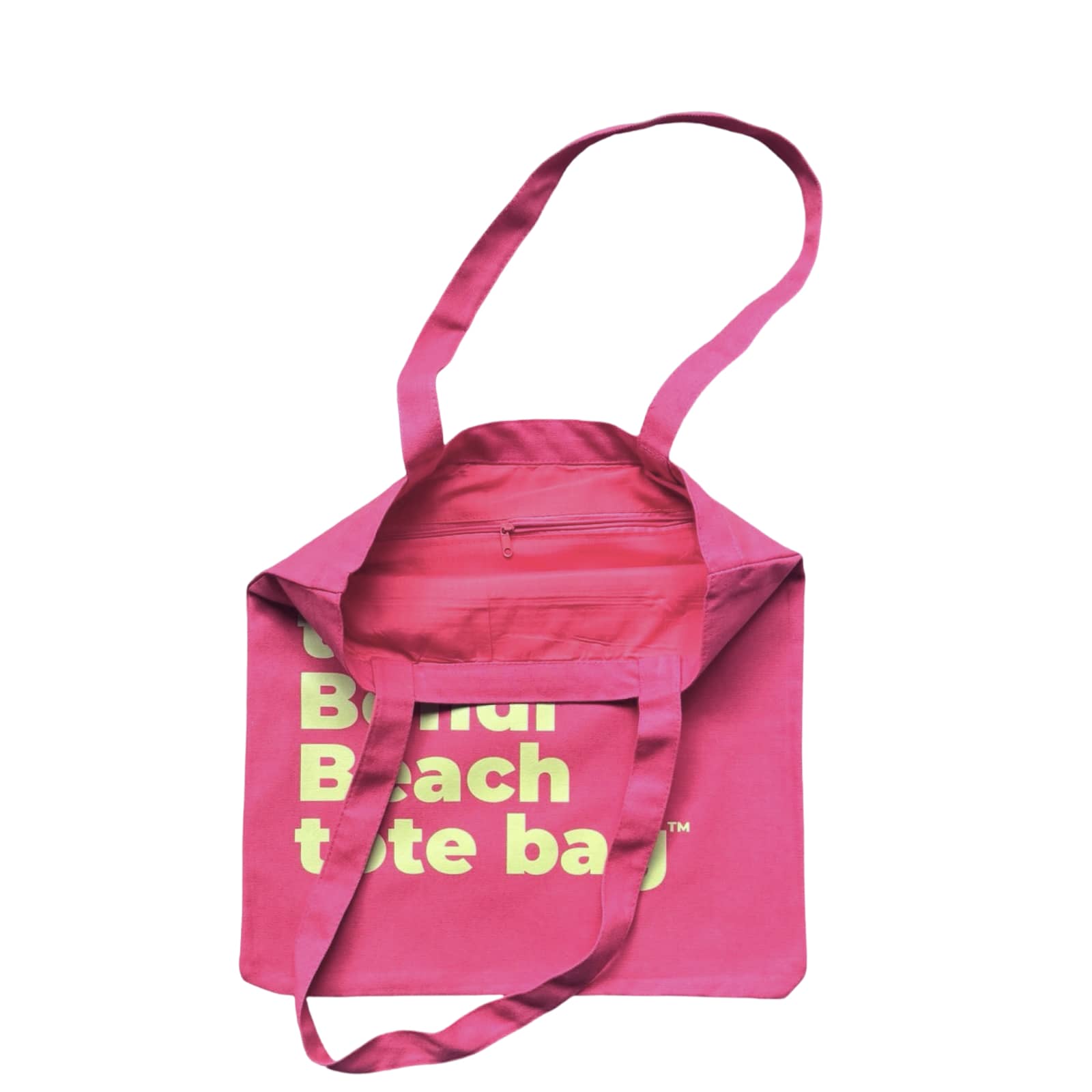 The Bondi Beach tote bag Little Bondi in pink with green print open showing zip pocket and lining