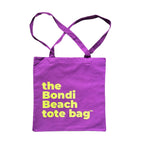 The Bondi Beach tote bag Little Bondi in purple with green print flatlay closed showing slim durable canvas