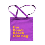The Bondi Beach tote bag Little Bondi in purple with orange print flatlay closed showing slim durable canvas